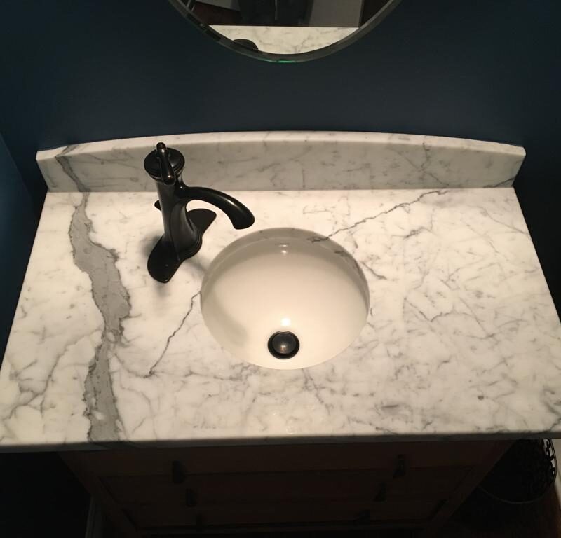 A gorgeous marble sink countertop in a restroom.